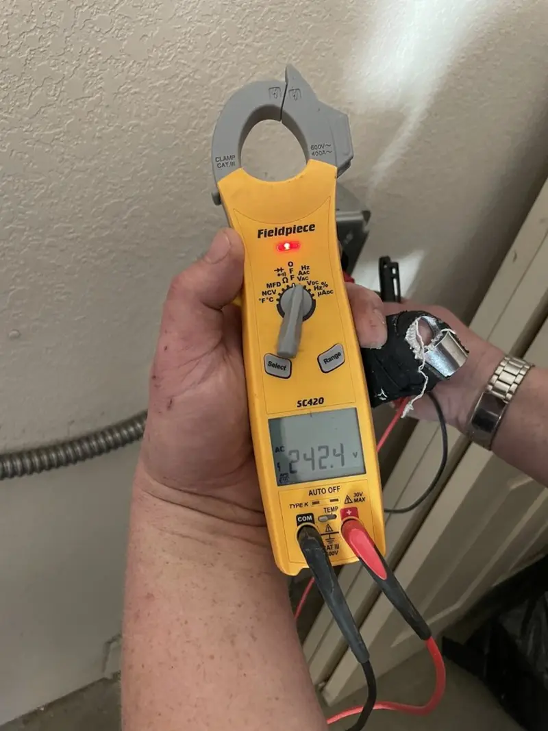 Voltage testing with clamp meter during Ceiling Fan Installation in Chester Heights